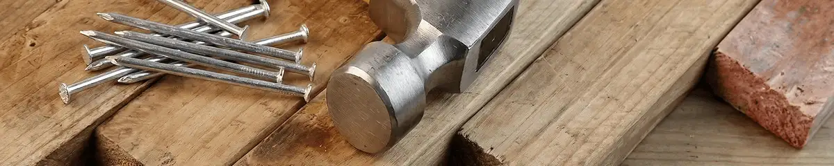 Hammer and nails on hardwood flooring boards in Ogden, UT