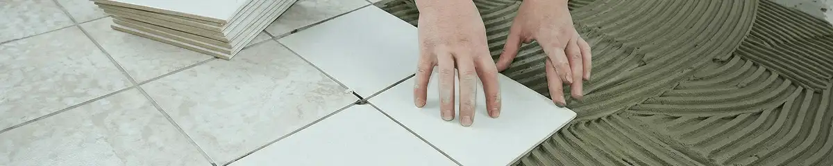 Professional installing white tile floors in Ogden, UT