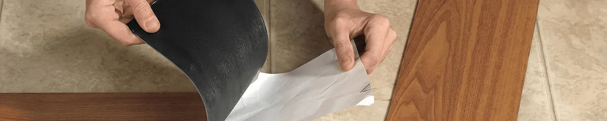 A professional installing vinyl flooring in Ogden, UT